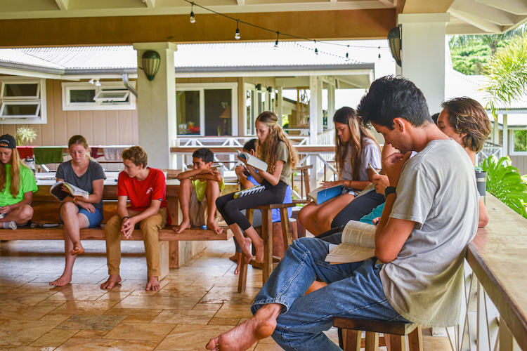 Malanalani teenage campers writing in their journals